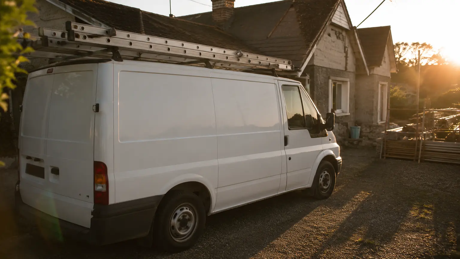Roofer's van parked outside Irish house during roofing job