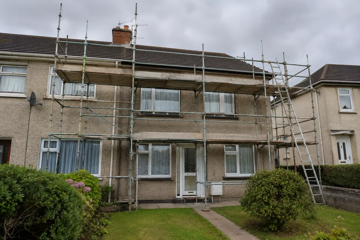 Scaffold around an Irish semi-detached house set up for roofing work