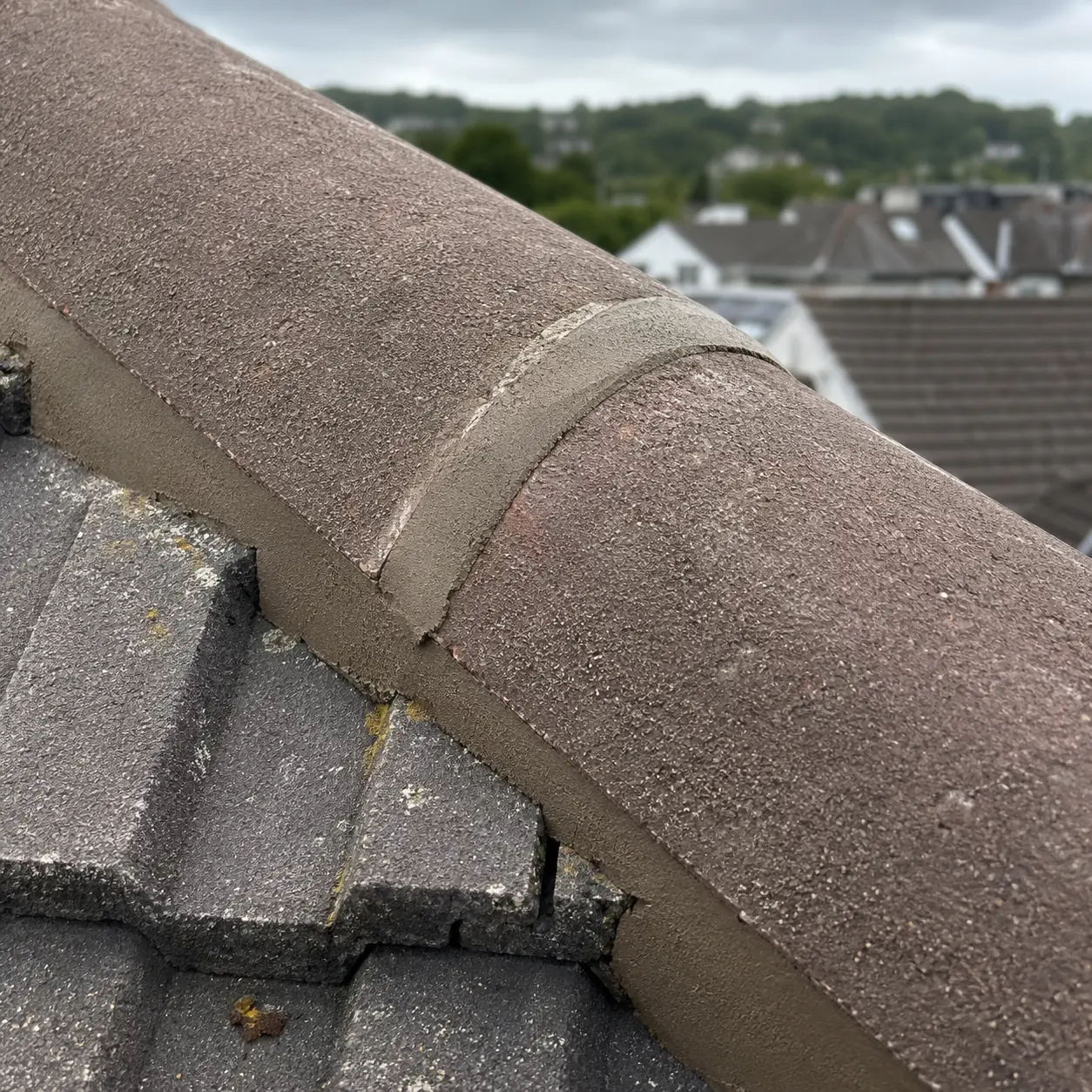Repointed ridge cap on a tiled roof